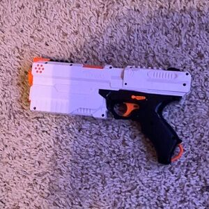 White and Black Toy Blaster with Orange Highlights